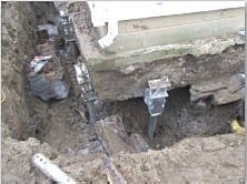 Secondary Footing Removed Helical Piers Installed After